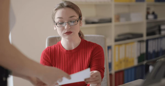 child custody expert witness holding paper.