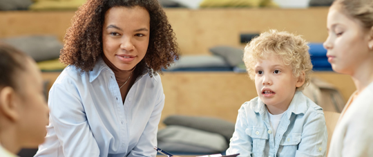 an adult with a few kids.