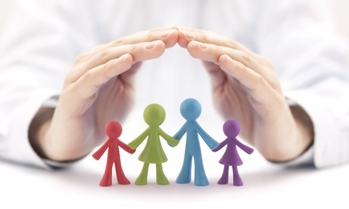 hands surrounding family figurine